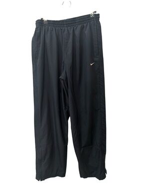 Nike track pants, typically featuring a solid blue color mens size M